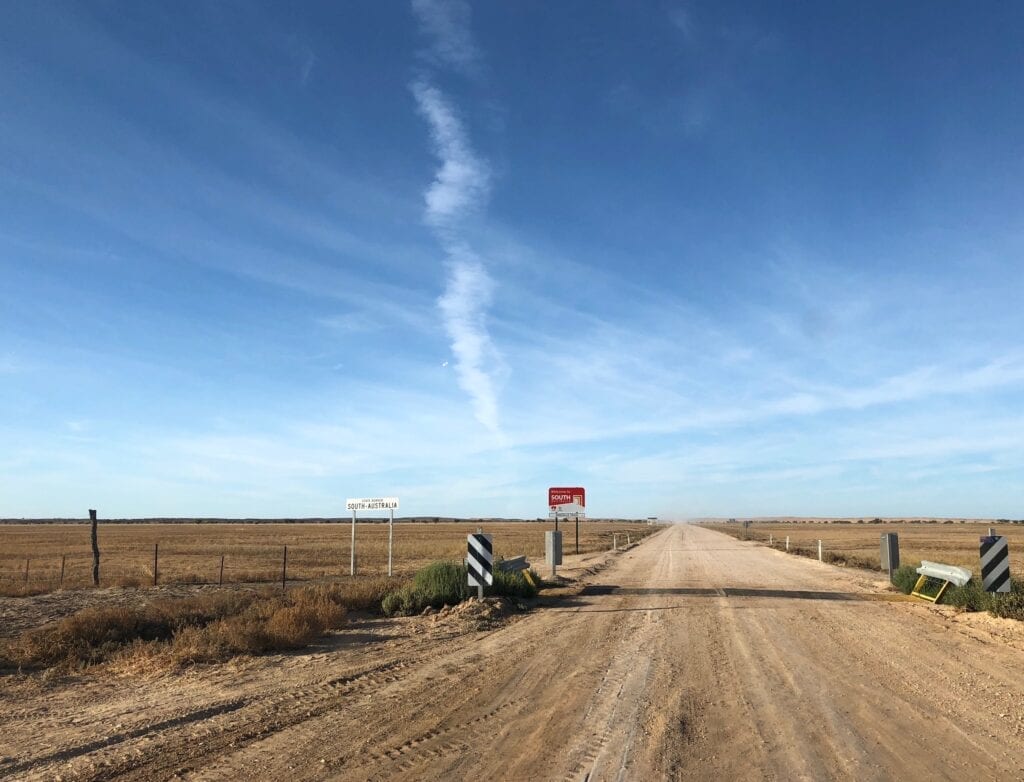 Crossing the QLD/SA border on the Birdsville Track.