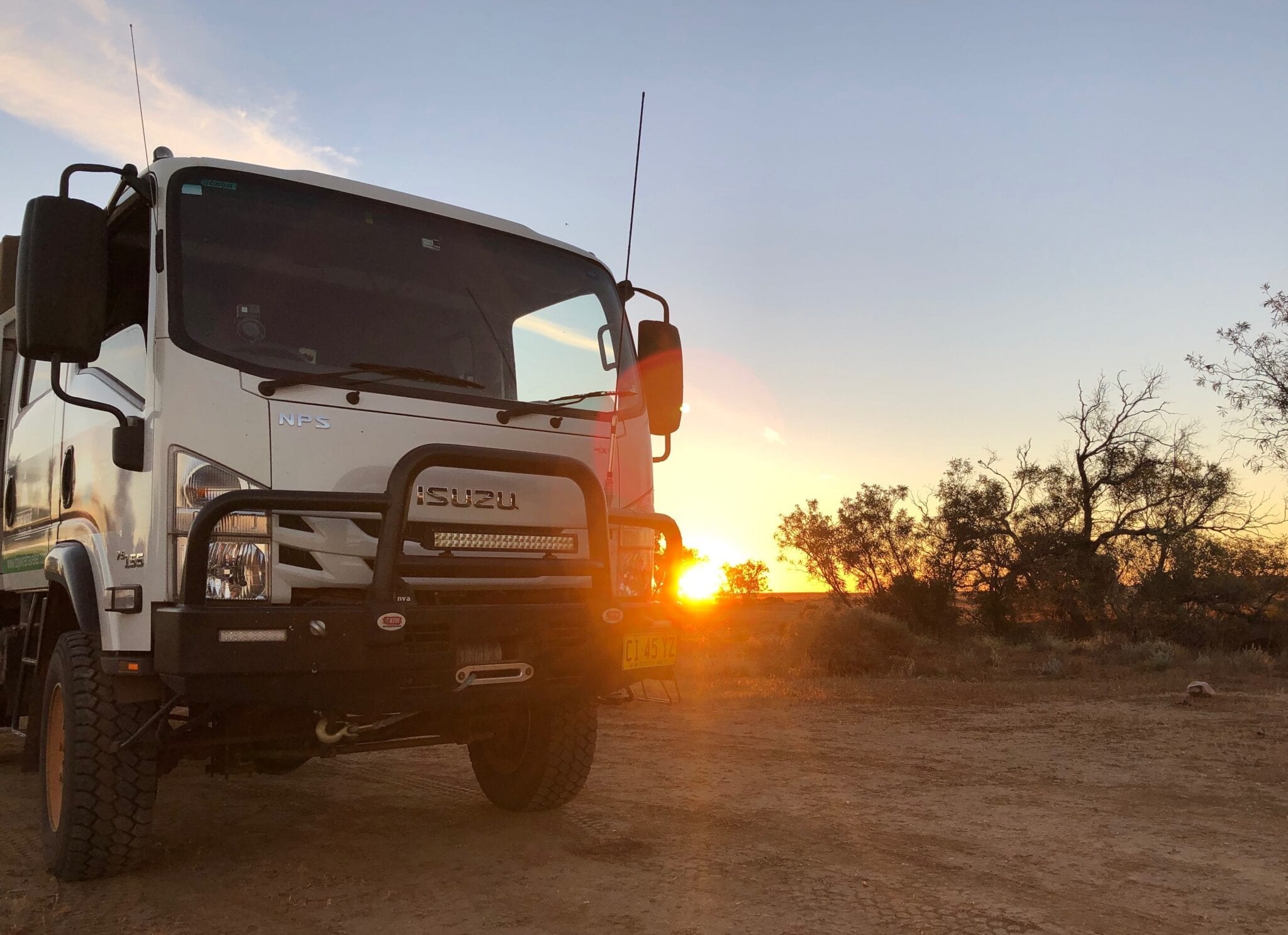 Our Isuzu NPS 4x4 truck camped beside Cooper Creek at Walkers Crossing.