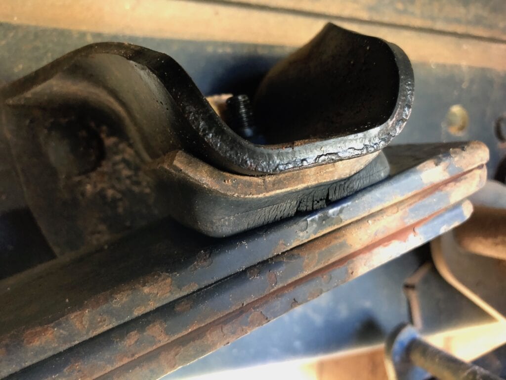 The rubber bump stops on the helper springs of our Isuzu NPS 4x4 truck are worn out.