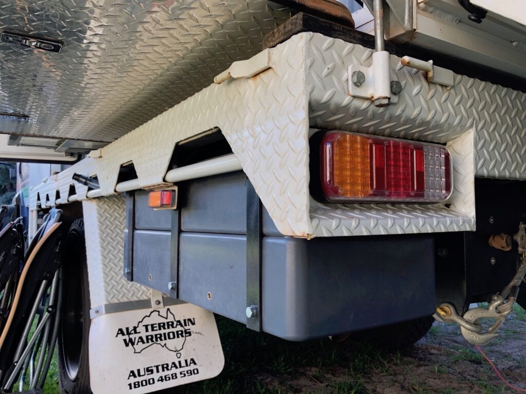 Water tanks fitted behind the rear wheels on our Isuzu NPS 4x4 truck.