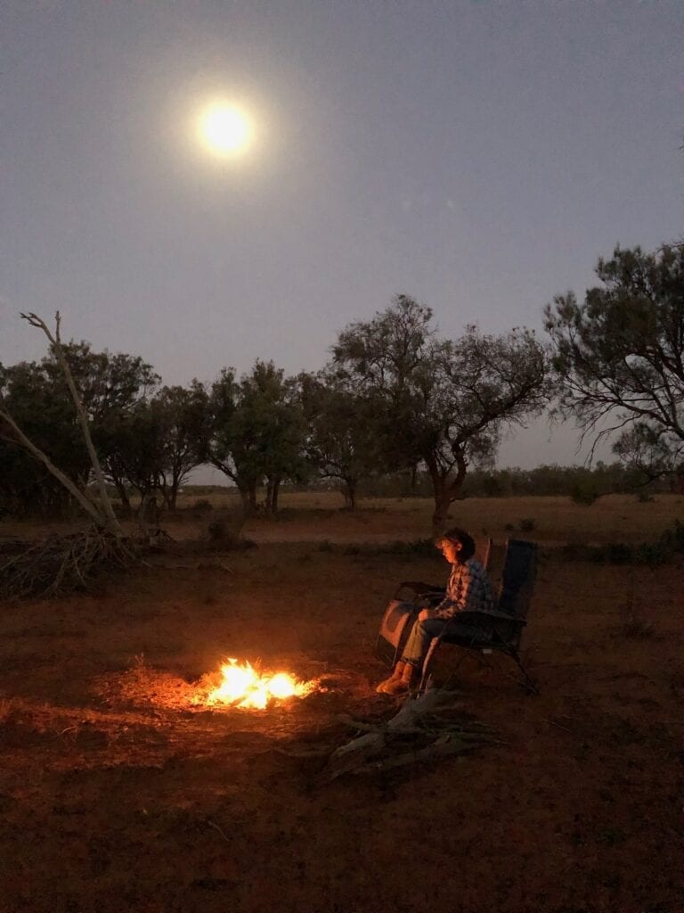 A campfire under a full moon at the Sunraysia Safari.