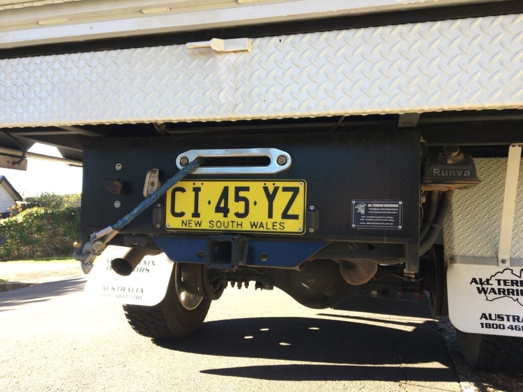 Preparing for the worst. We decided to fix winches front and back on our Isuzu NPS truck.