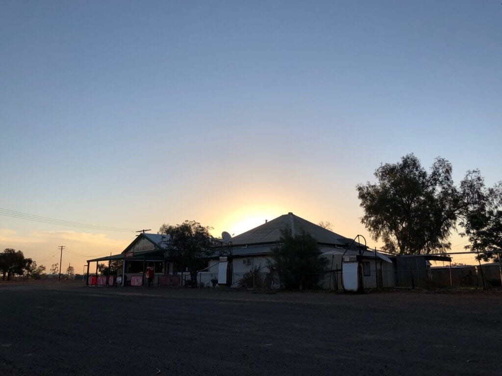 The sun setting behind Wanaaring Store, NSW.