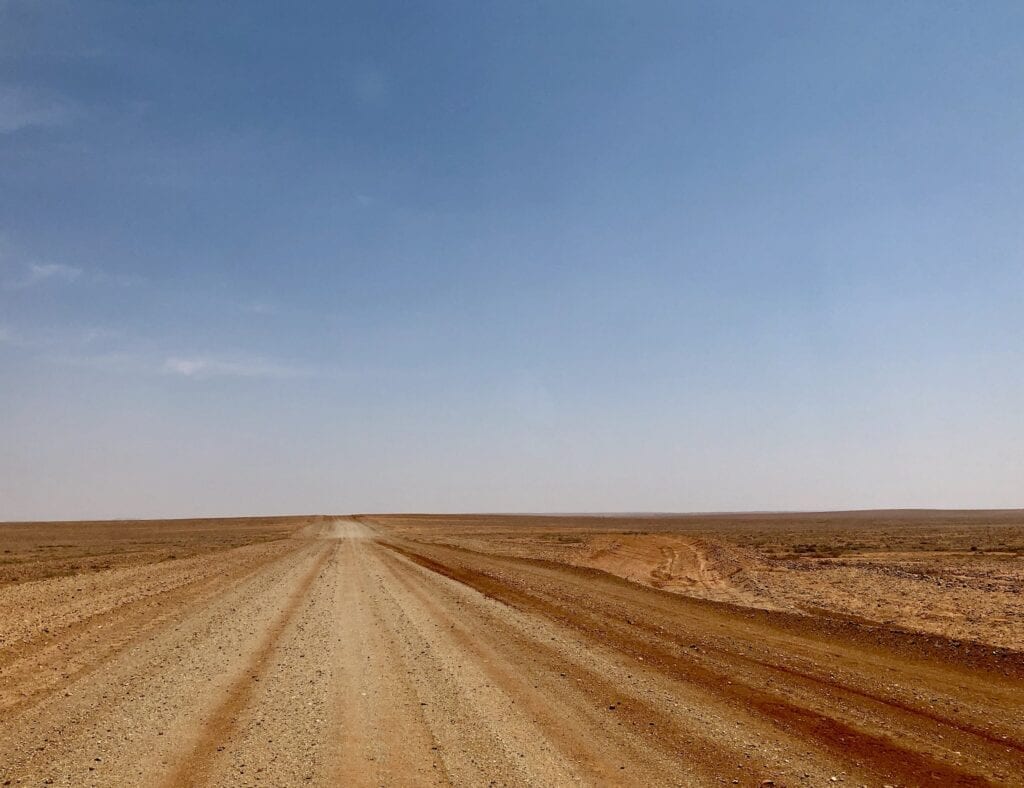 Driving west on the Tibooburra to Cameron Corner Road in Australia's outback.