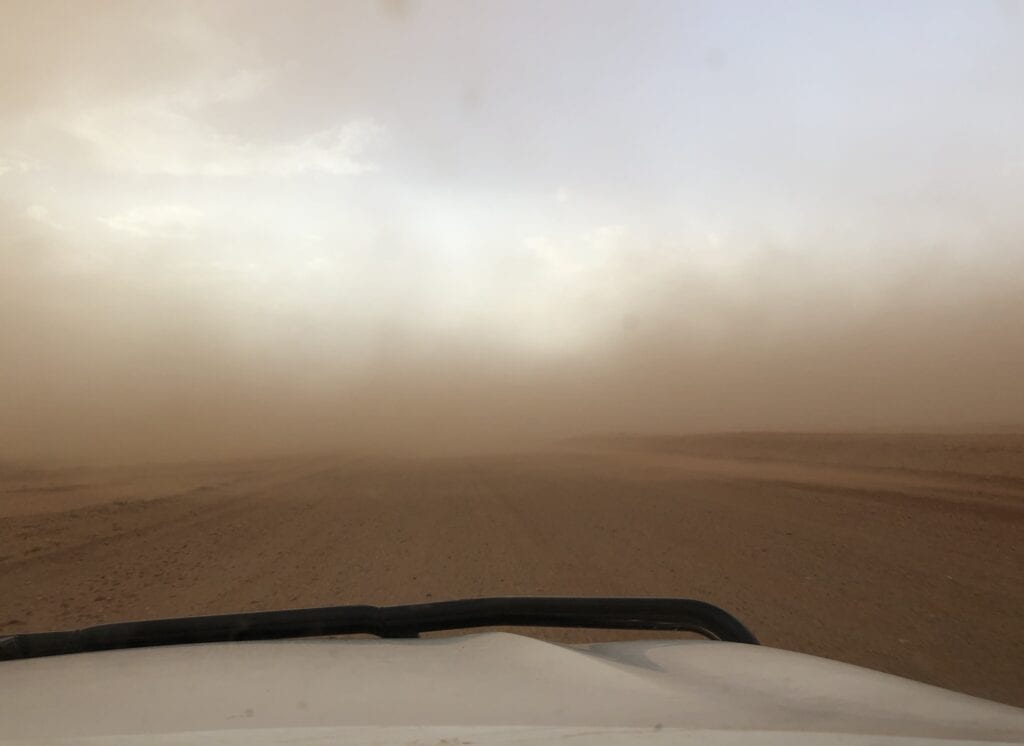 Driving along the Tibooburra to Cameron Corner Road, straight into a dust storm.