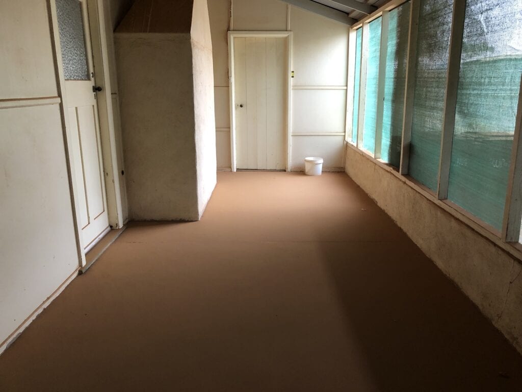 The verandah floor of Fort Grey homestead was covered in a uniform layer of dust and sand after the dust storm. Fort Grey, Sturt National Park.