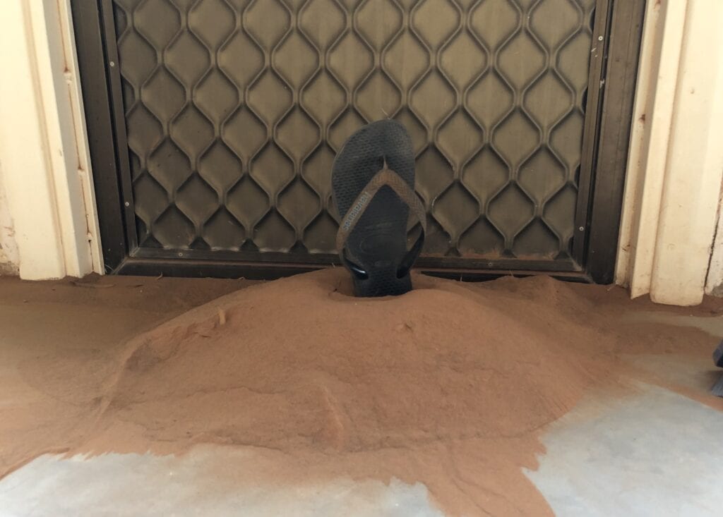 A deep pile of sand from a dust storm. Swept up from the verandah of Fort Grey Homestead, Sturt National Park NSW.