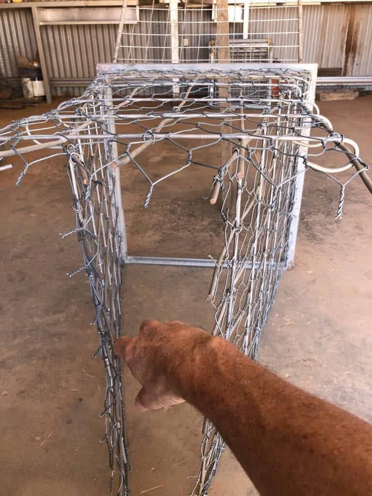 One way kangaroo gate allows roos to squeeze out through the opening, which springs closed behind them. Wild Deserts, Sturt National Park NSW. We made up some frames, tops and sides as part of our caretaker role.