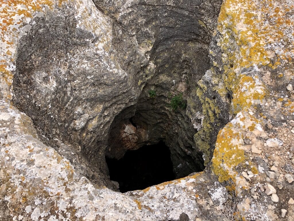 One of the shafts at Koomooloobooka Cave. This opens into a large underground chamber. Old Eyre Highway, Nullarbor Plain SA.