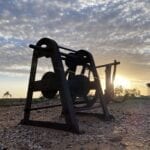 An old hand winch silhouetted by the afternoon sun. Milparinka NSW.