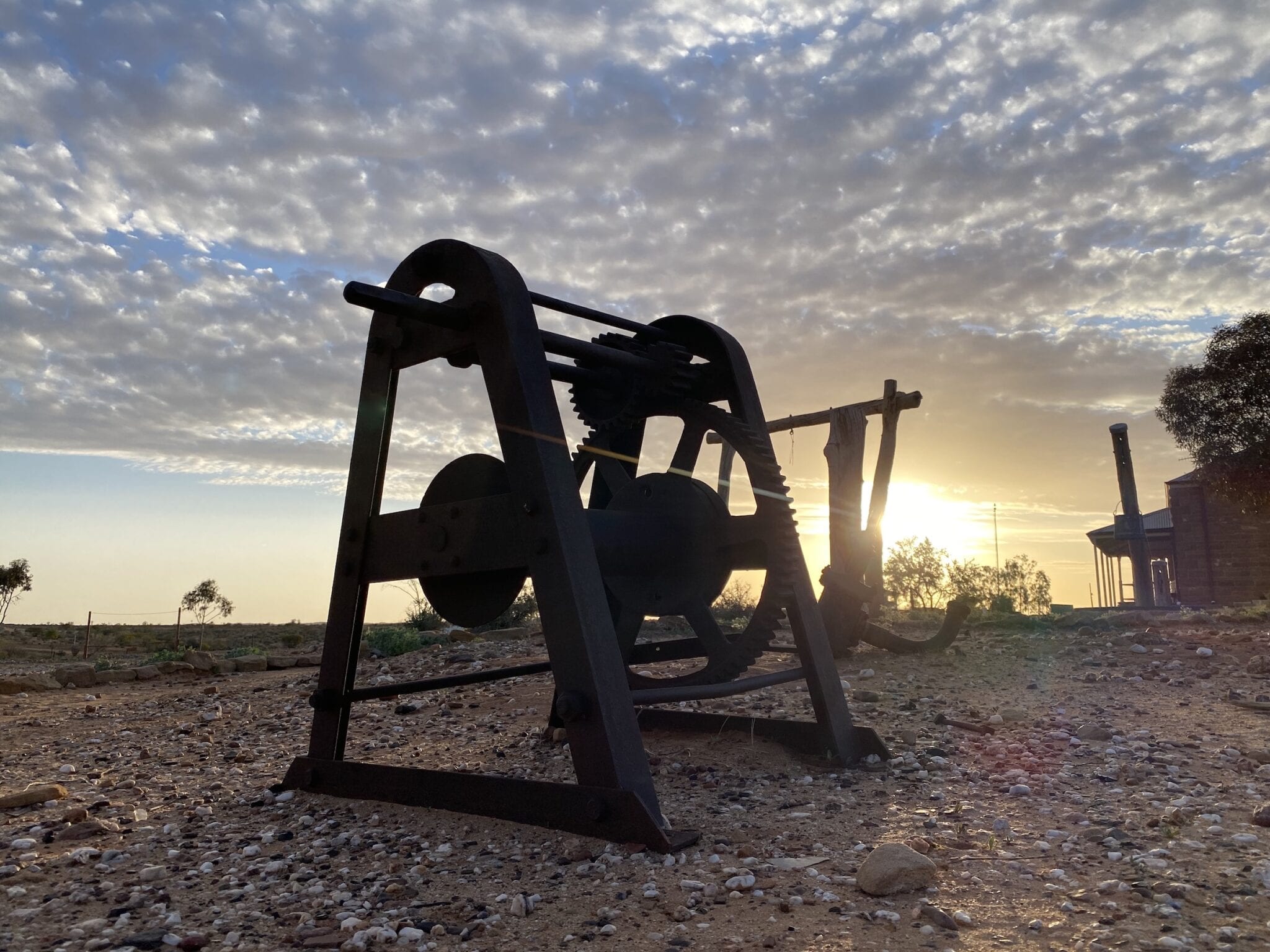 An old hand winch silhouetted by the afternoon sun. Milparinka NSW.