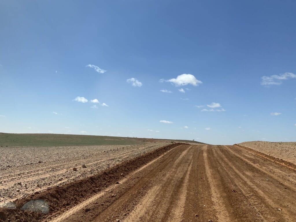 The arid gibber country west of Milparinka, NSW showing a tinge of green.