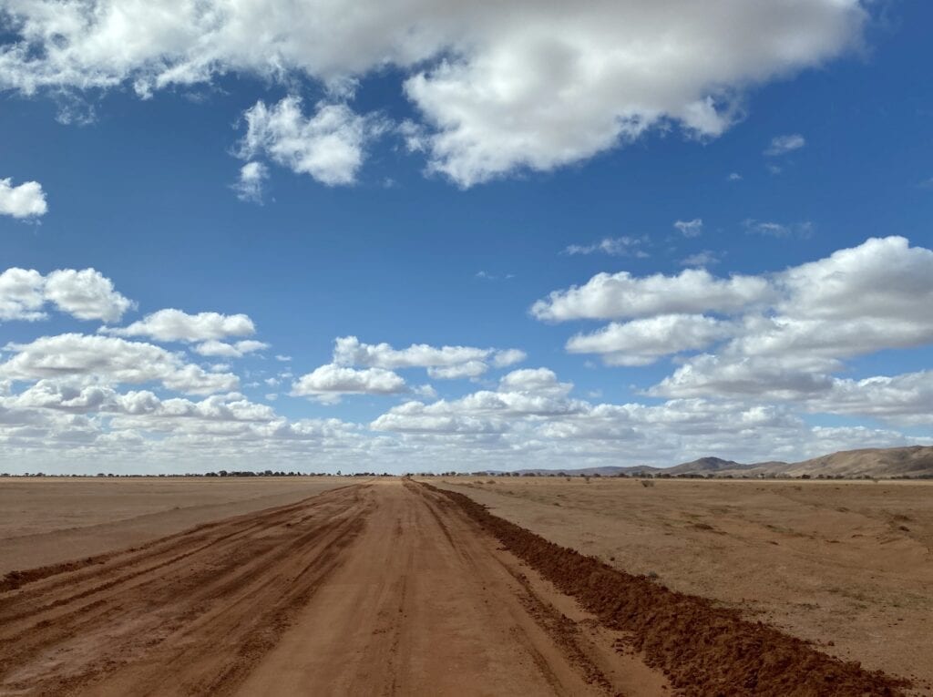 Driving across Mundi Mundi Plain with the Barrier Ranges off to the right. Far western NSW.