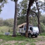 Wedgetail slide on camper and Isuzu 4WD truck camped at Goulburn River National Park.