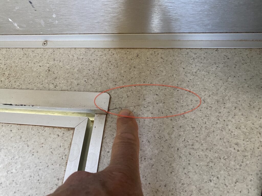 A small crack on the laminated benchtop of our Wedgetail camper.