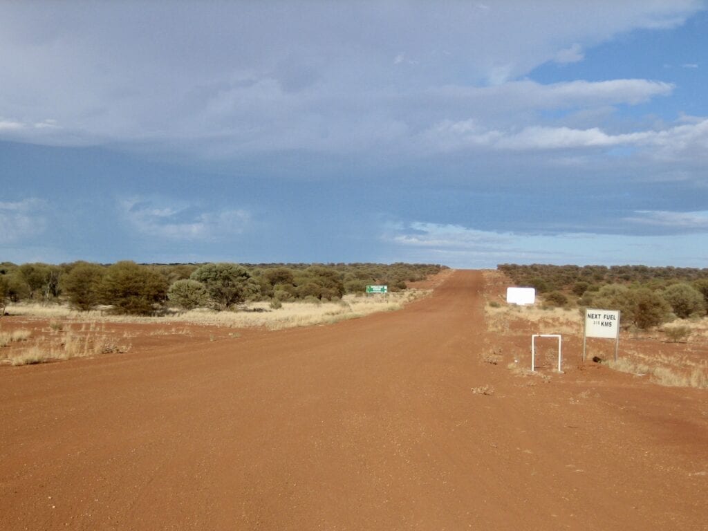 A remote and isolated Outback road in the Western Australian desert.