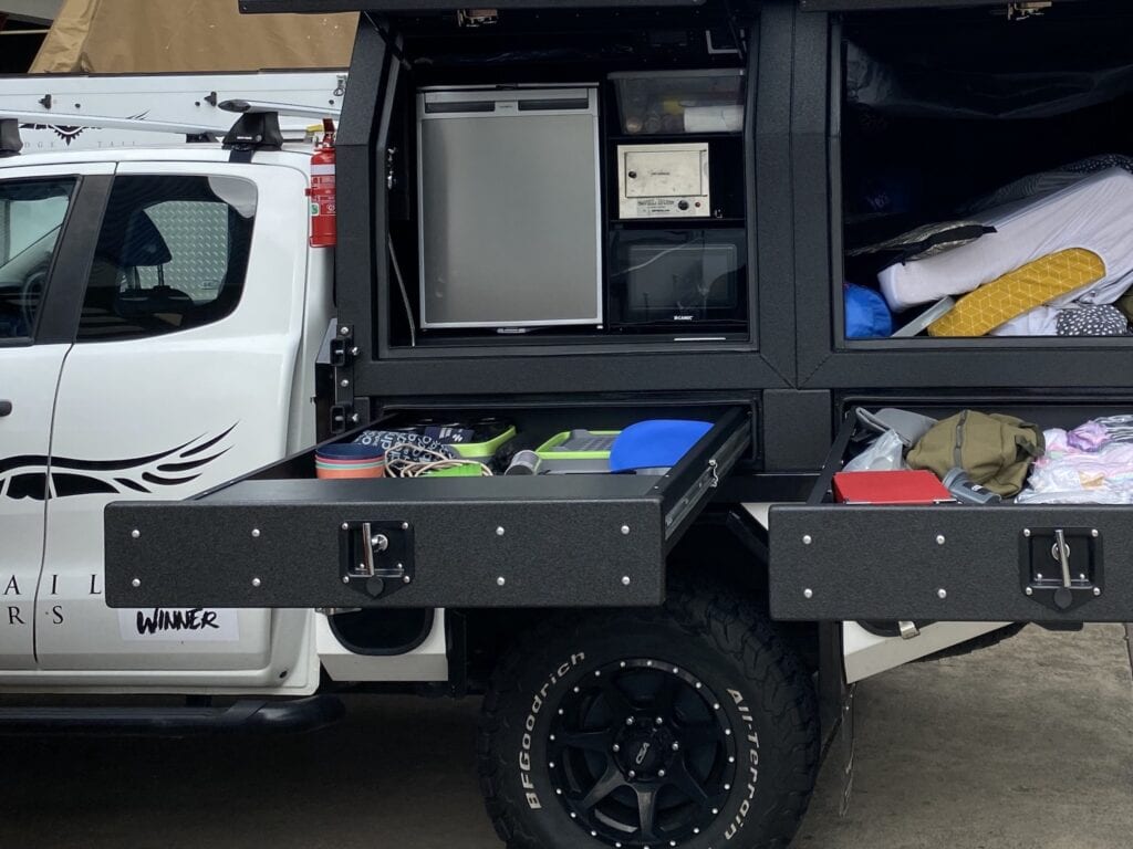 Slide-out drawers for storage installed on a Wedgetail Hawk ute slide-on camper.