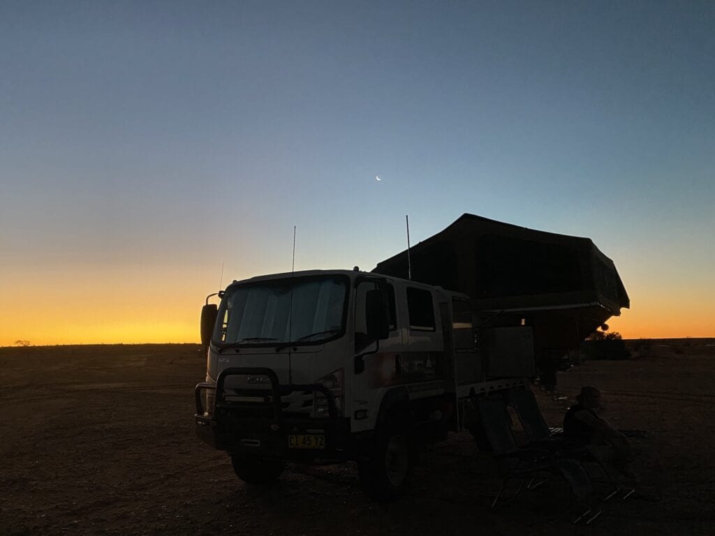 Our truck camper silhouetted against the setting sun. Haddon Corner, QLD.