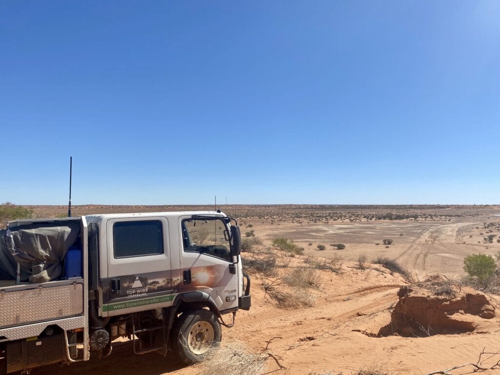 Our truck camper on top of a sand dune on the track into Haddon Corner, QLD.