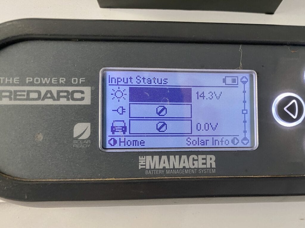 REDARC battery monitor showing input voltage from a 112W amorphous solar blanket.