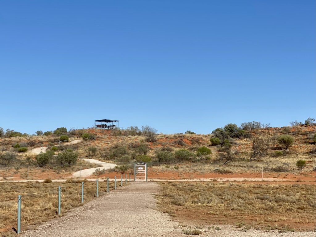 Talpero Lookout with walking path up a high sand dune in Sturt National Park.