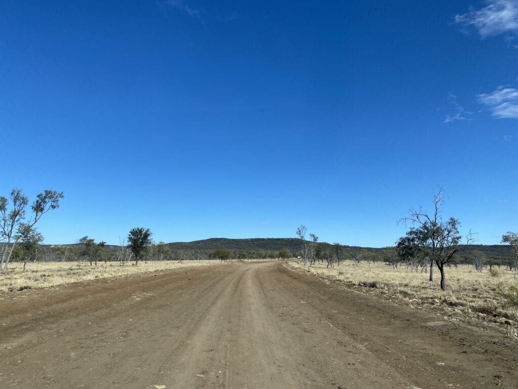 Driving into Idalia National Park QLD across black soil plains.