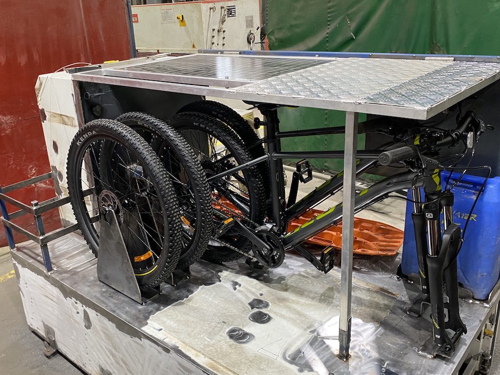 Test-fitting of mountain bikes on the storage boxes of our Isuzu NPS crew cab.