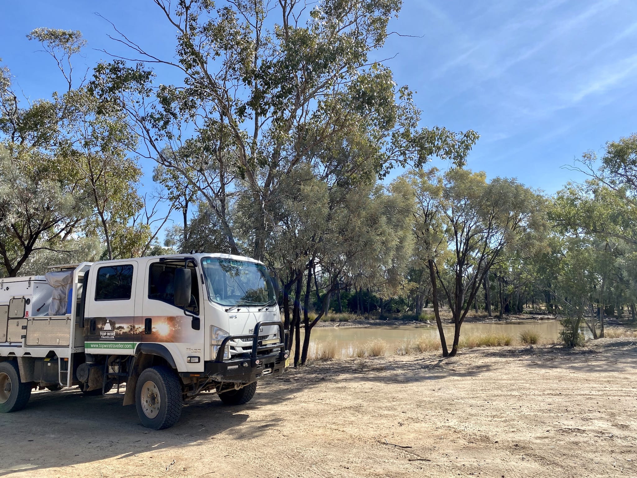 Our Isuzu truck camper parked at Junction Waterhole, Idalia National Park QLD.