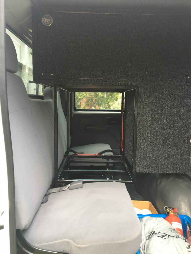 Our first attempt at storage in the rear seat area of our Isuzu NPS crew cab.