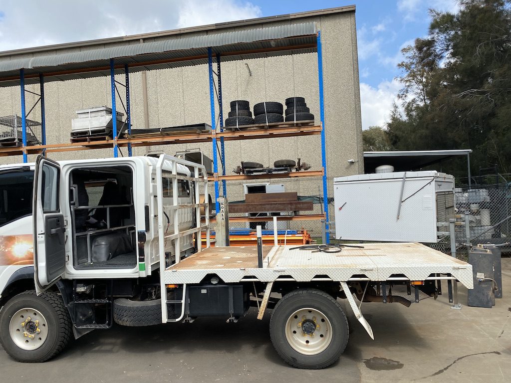 Old tray stripped down, ready for removal from our Isuzu NPS crew cab.