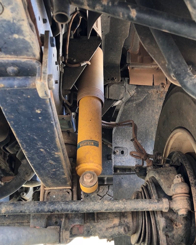 Isuzu NPS shock absorber mounted on the front left.