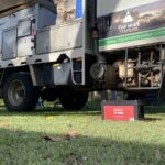 REDARC 200Ah lithium battery in front of an Isuzu NPS with a Wedgetail Camper.