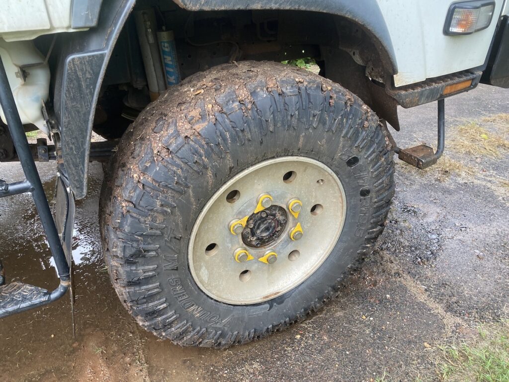 Founders 305/70R19.5 mud tyre on front axle of Isuzu NPS.