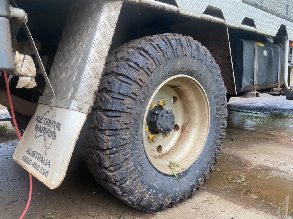 Founders 305/70R19.5 mud tyre on rear axle of Isuzu NPS.