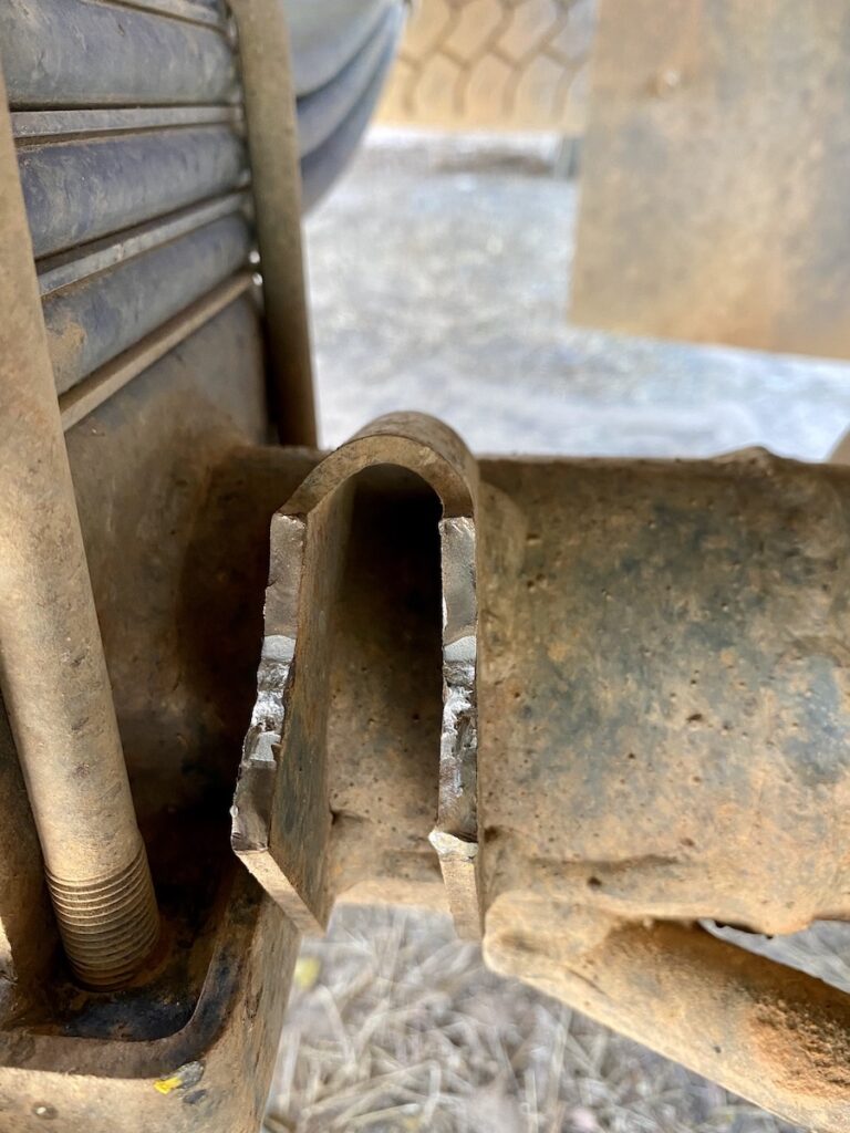 Broken front left, lower shock mount on an Isuzu NPS 4WD truck.