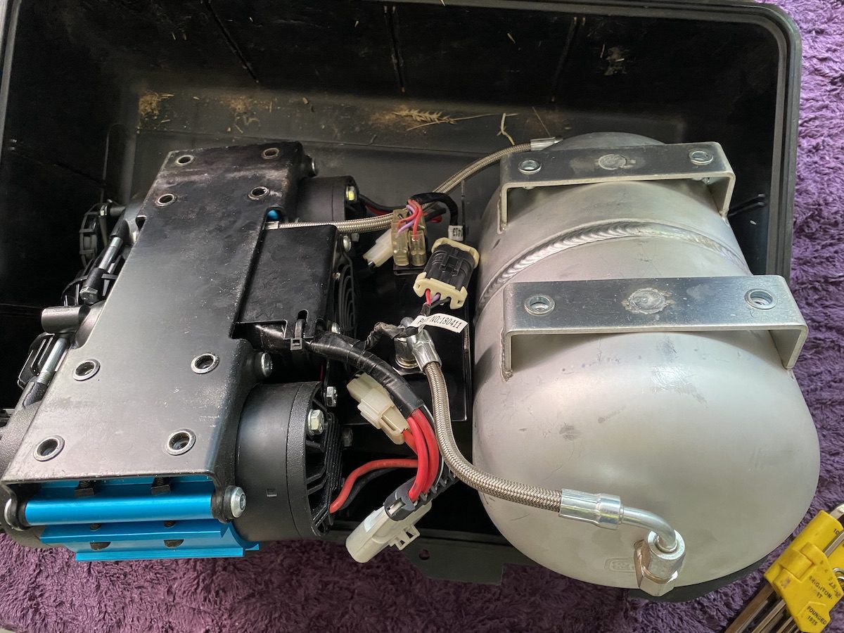 Portable twin ARB compressor with air tank removed from carry case.