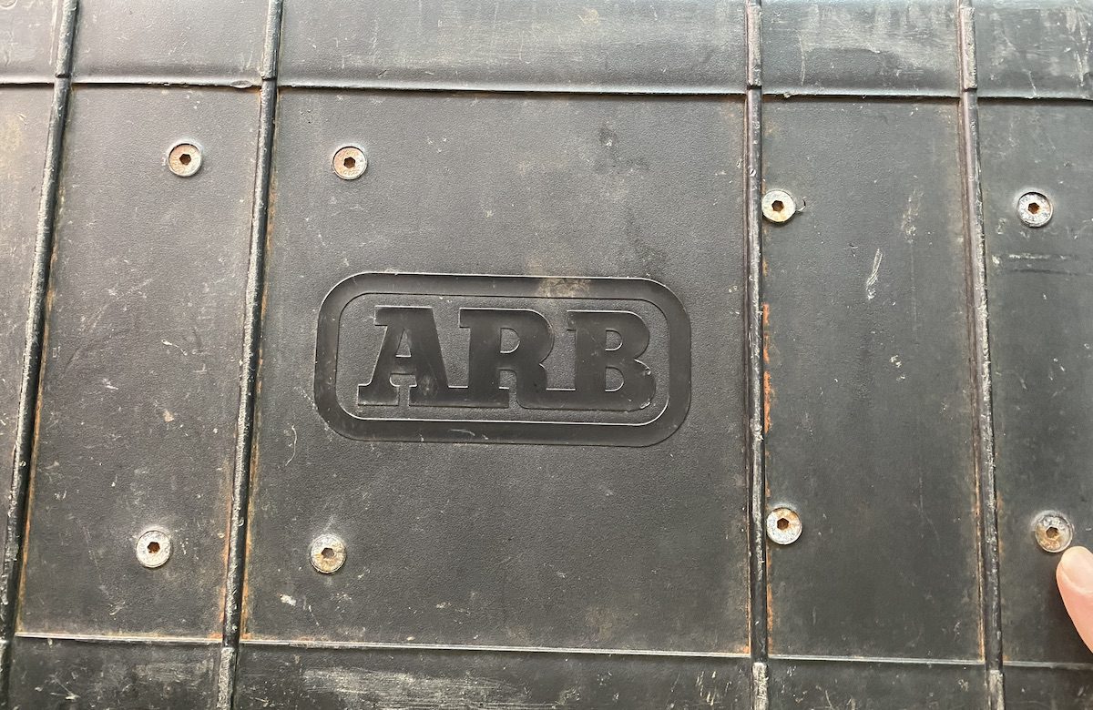 Underside of ARB twin compressor carry case showing mounting screws which hold compressor in place.