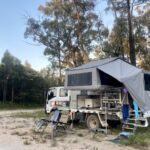 Wedgetail Camper set up in the bush with grey camper canvas.