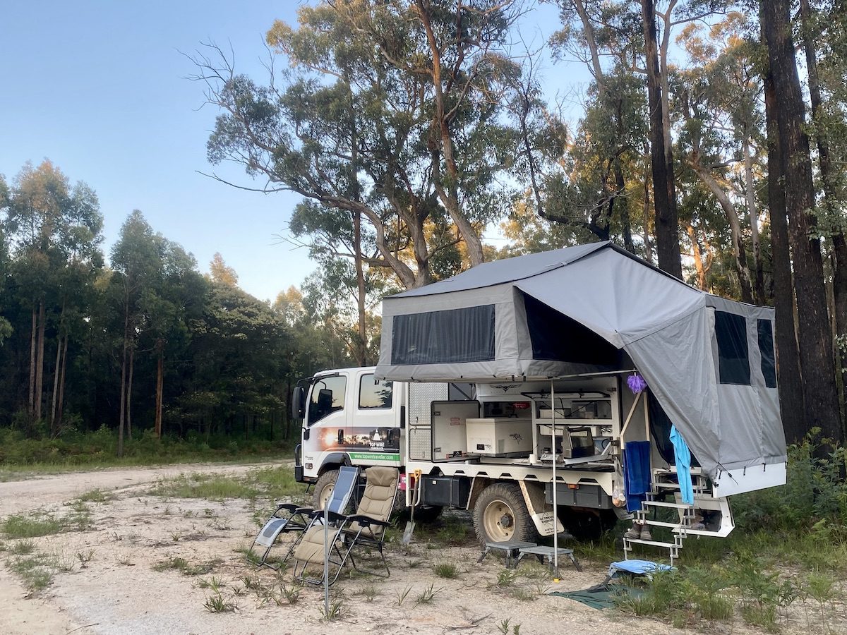 Wedgetail Camper set up in the bush with grey camper canvas.