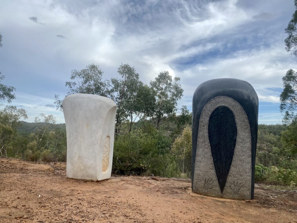 Yuundu Yuundu (Axe Axe) sculpture with white axe and black axe. Sculptures In The Scrub, Pilliga Forest NSW.