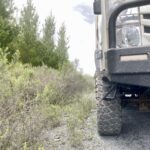 Isuzu NPS truck with Founders 19.5 tyres in a pine forest.