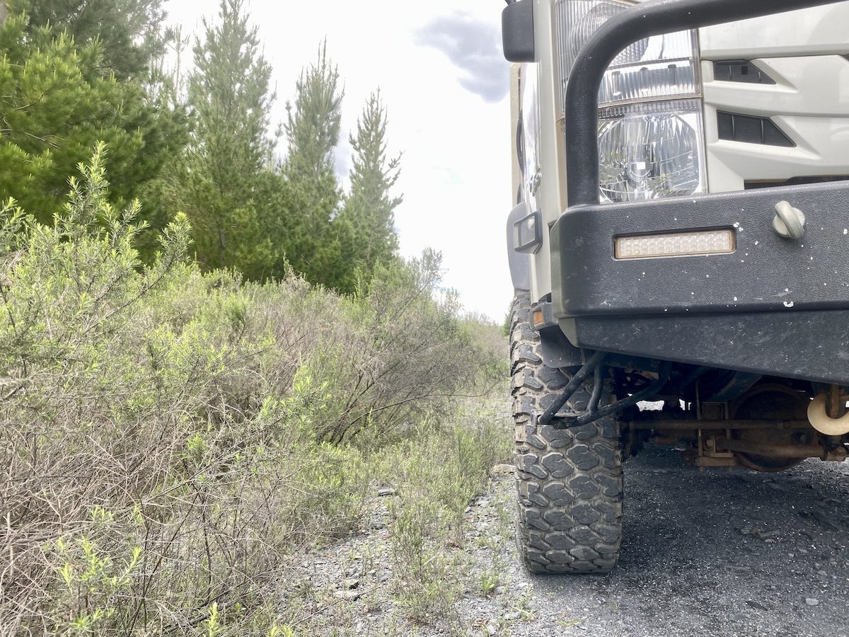 Isuzu NPS truck with Founders 19.5 tyres in a pine forest.