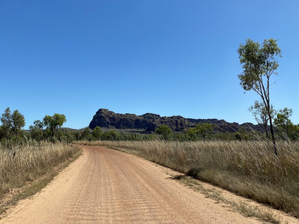 Driving into Goorrandalng Campground, Keep River National Park. Beehive mountain formations ahead.