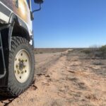 Isuzu NPS truck with Founders tyres on a desert sand dune.