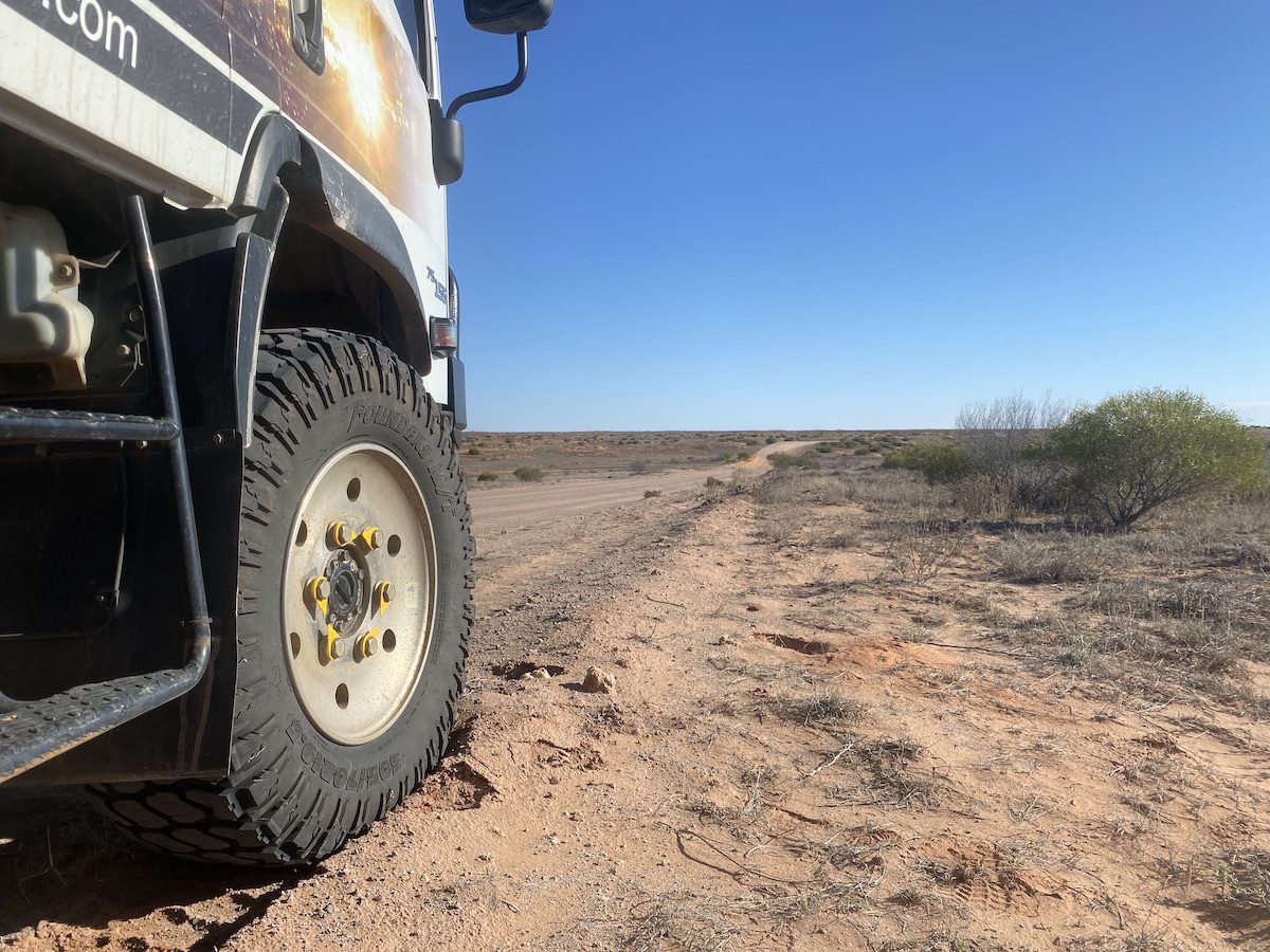 Isuzu NPS truck with Founders tyres on a desert sand dune.