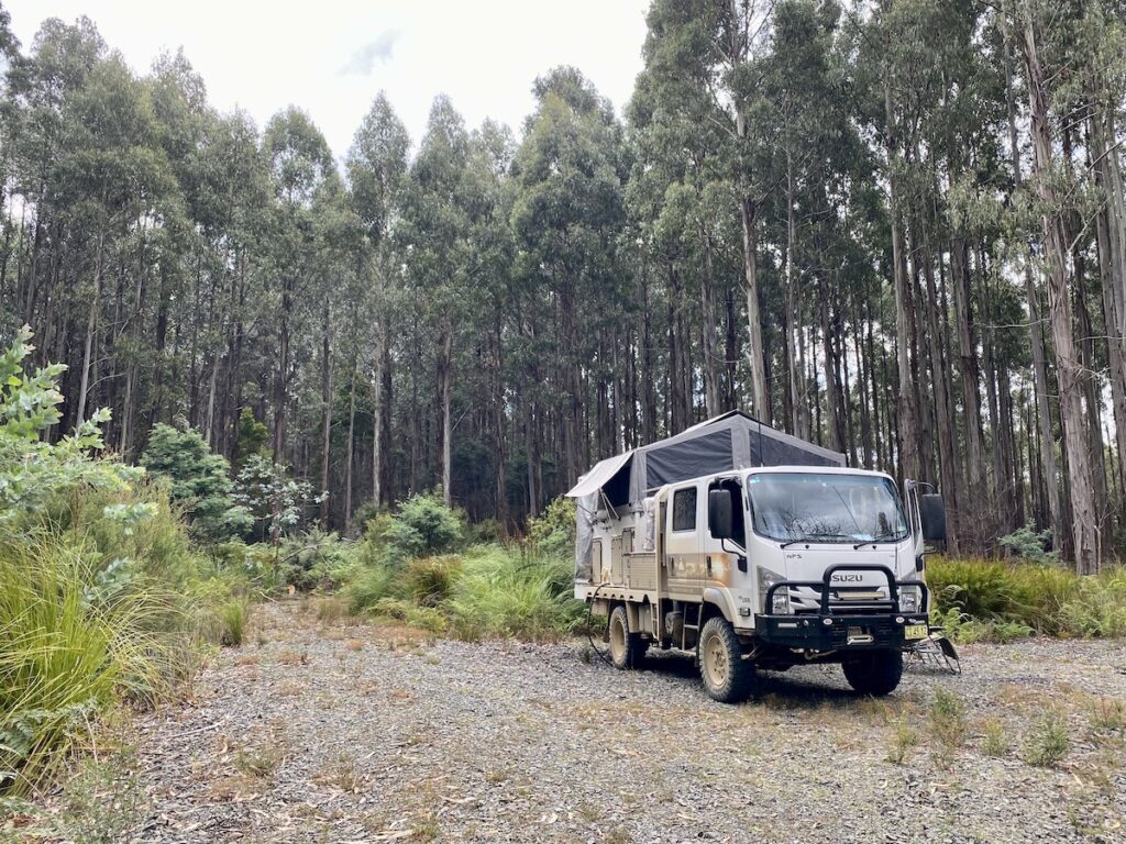 Our truck camper set up in a Tasmanian stste forest.